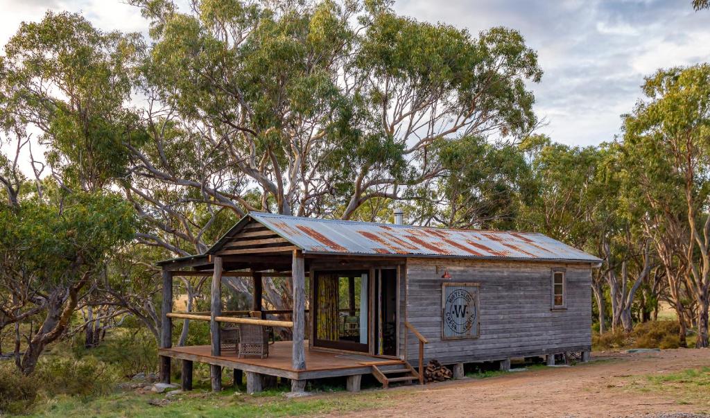 a small shack sitting in the middle of a field at Waterloo Station Country Stays in Glen Innes