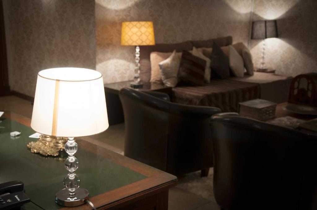 Postel nebo postele na pokoji v ubytování Hotel MAXIM
