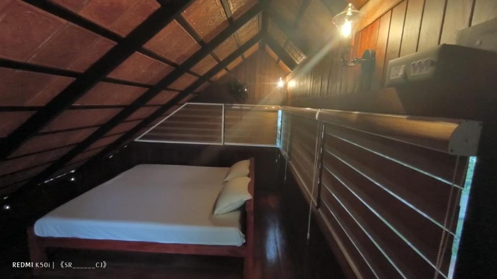 Postel nebo postele na pokoji v ubytování Tree House Wayanad