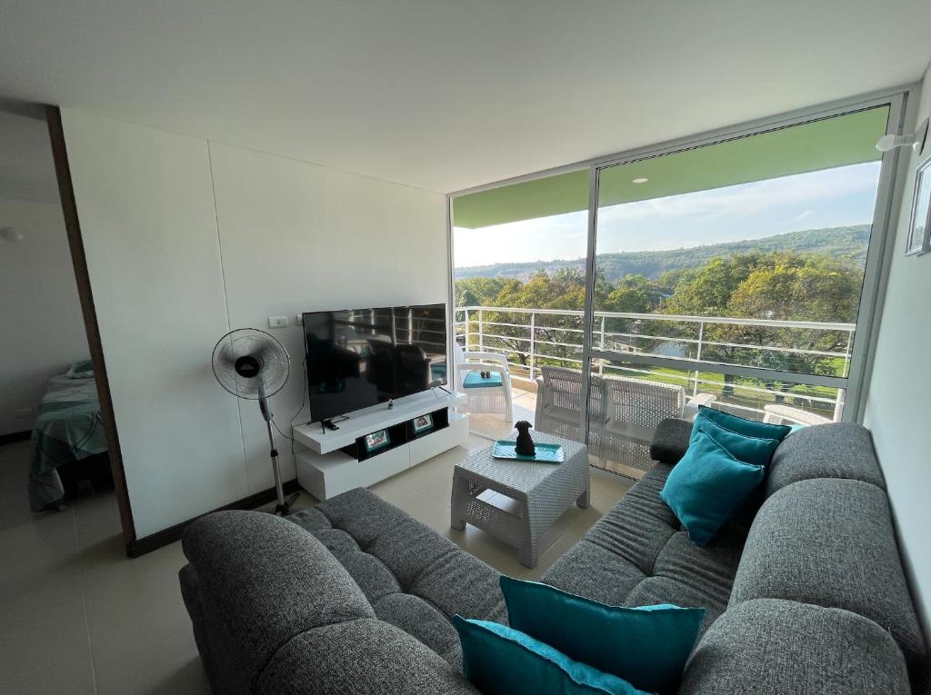 TV a/nebo společenská místnost v ubytování Espectacular apartamento en Melgar