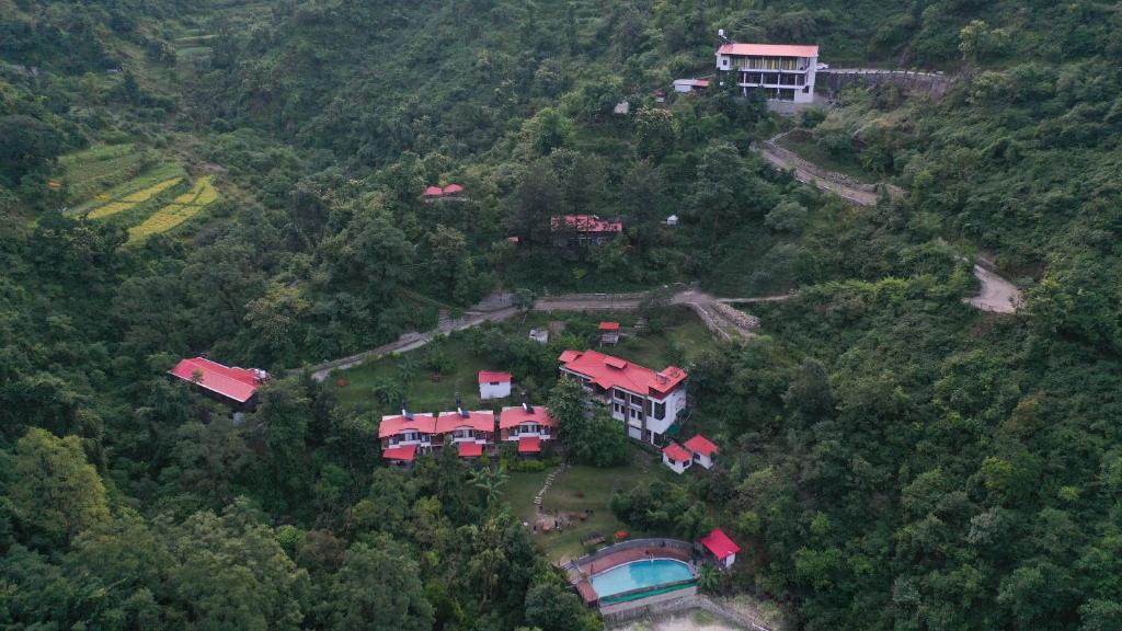 an aerial view of a house on a hill at Haut Monde Hill Stream Resort and Spa in Dehradun