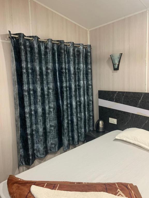 Postel nebo postele na pokoji v ubytování Sydney X Huts