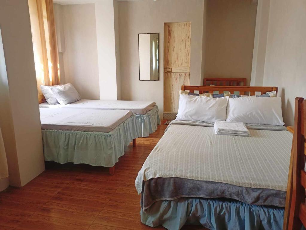 Postel nebo postele na pokoji v ubytování Pas-it Hostel Sagada