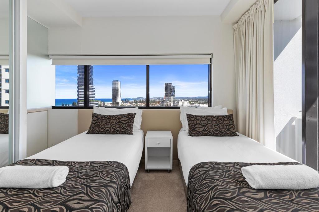 Postel nebo postele na pokoji v ubytování Ultra Broadbeach