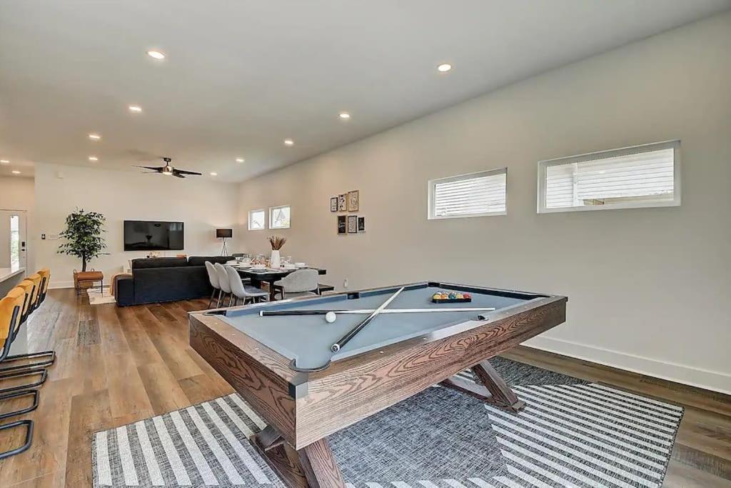 a living room with a pool table in it at NEW Luxury Home 10 Min To Downtown Pool Table in Indianapolis
