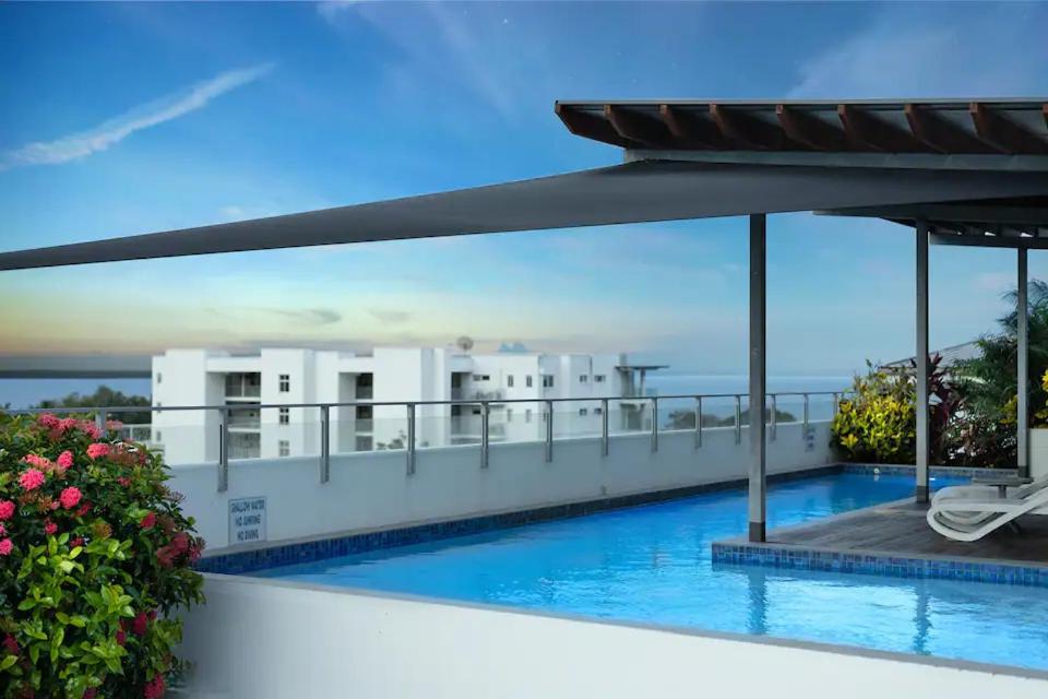 a view of a swimming pool on the roof of a building at Panoramic views 3BR Cairns City Apartment in Cairns