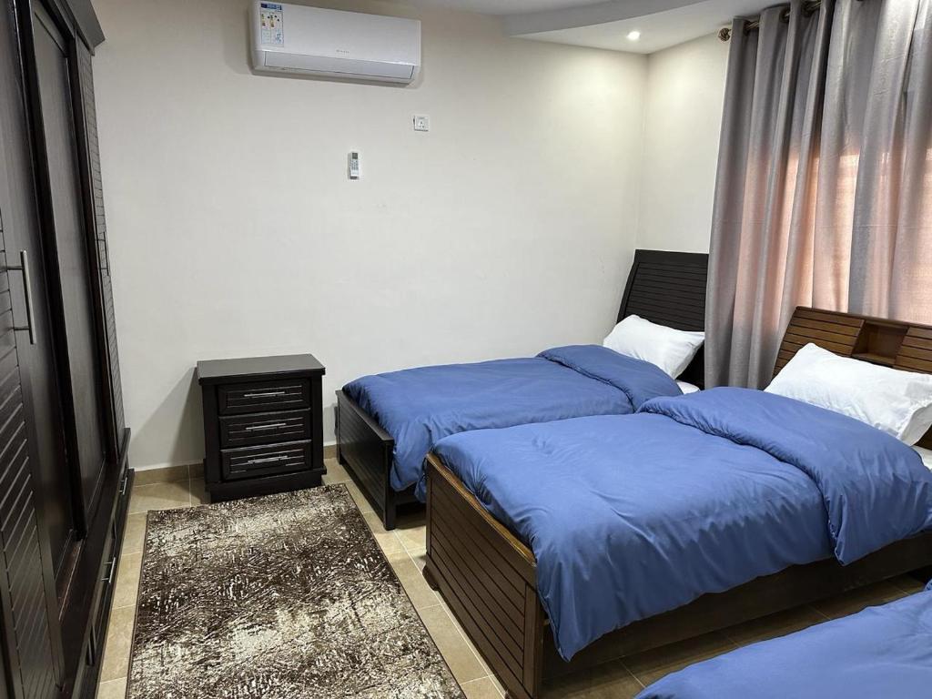 Postel nebo postele na pokoji v ubytování Amro Petra Apartment