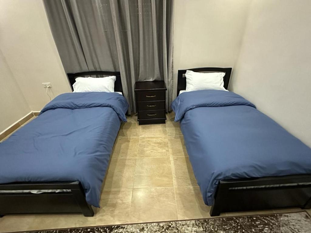 Postel nebo postele na pokoji v ubytování Amro Petra Apartment