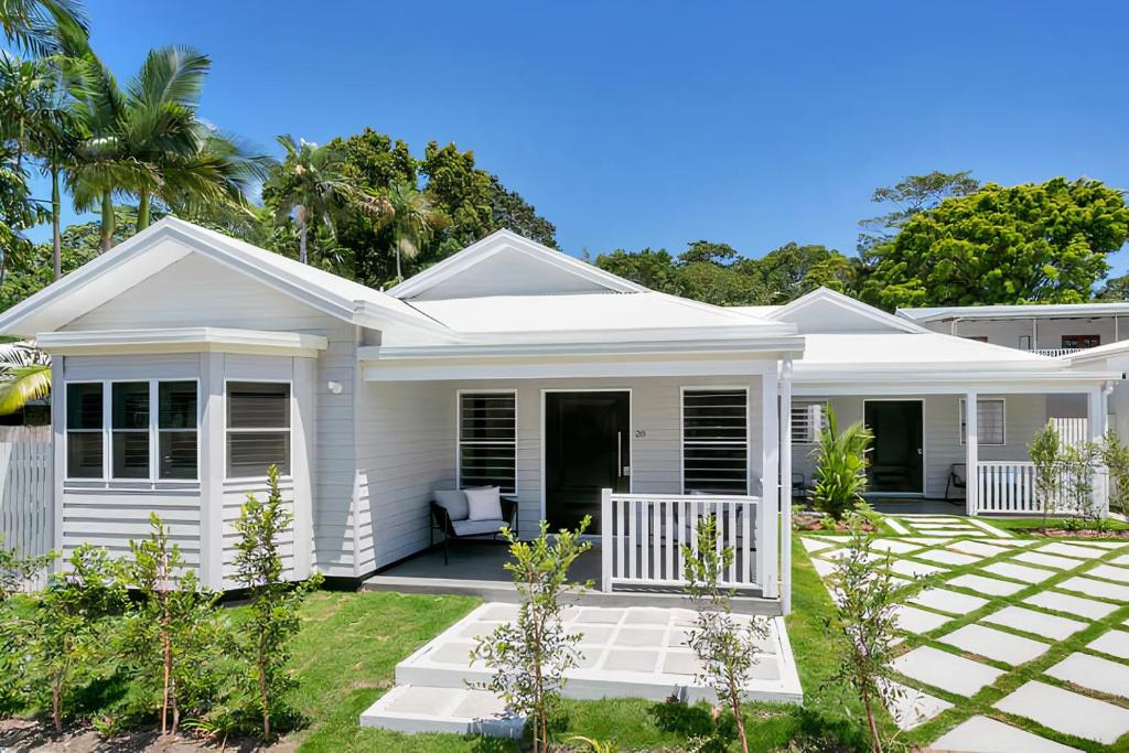 a white house with a porch at Industrial Luxe Villa - Boutique 1 bedroom luxury Villa in Edge Hill