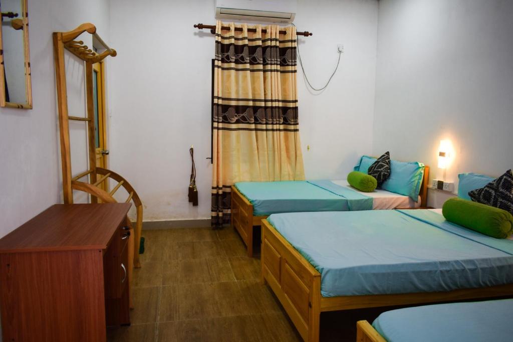 Postel nebo postele na pokoji v ubytování White Villa Hotel