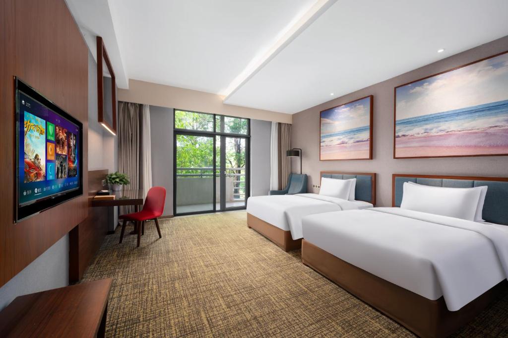 Кровать или кровати в номере Ausotel Smart Baiyun International Airport T2