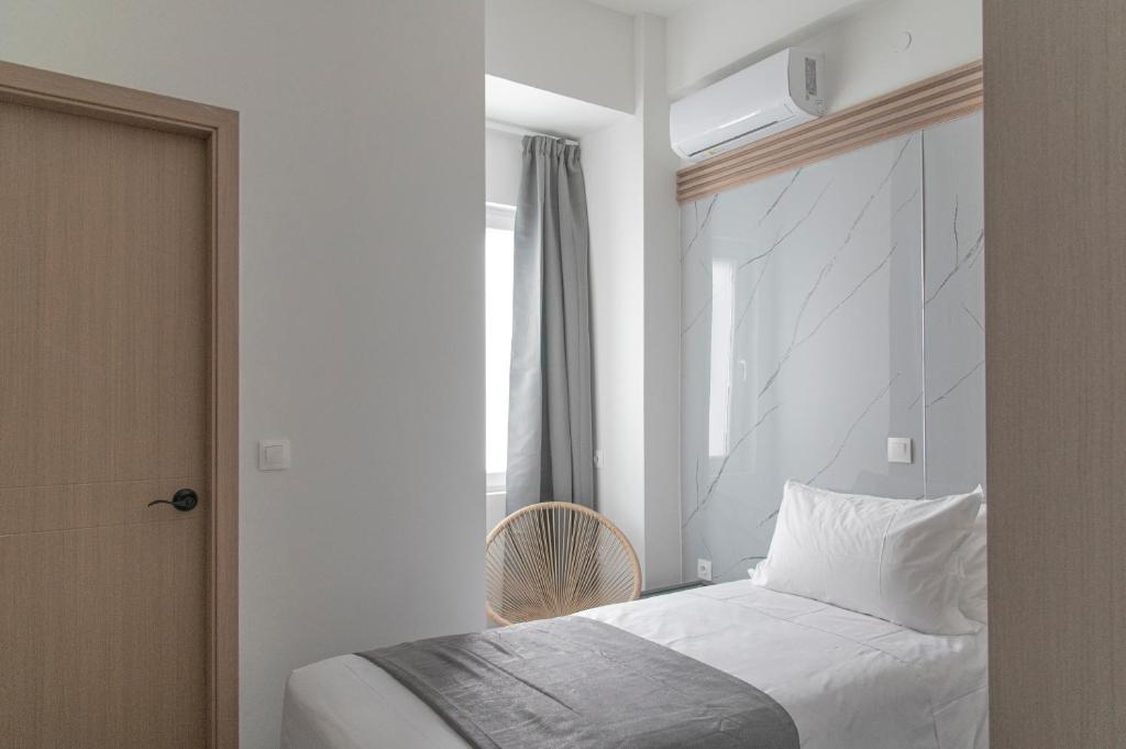 Postel nebo postele na pokoji v ubytování Celia Residence