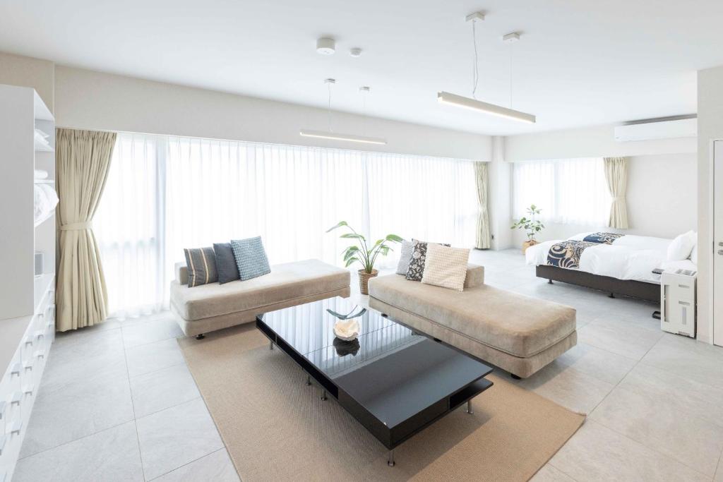 a living room with a couch and a bed at MARSOL C,S,Beach hotel - Vacation STAY 50798v in Chigasaki