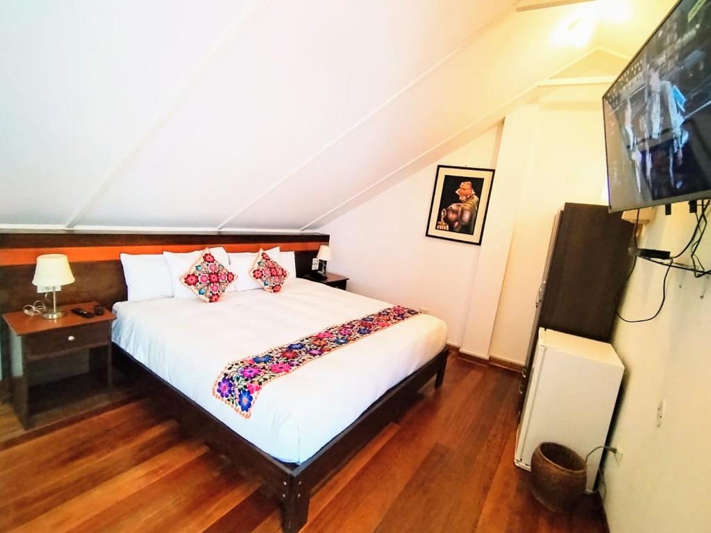 Postel nebo postele na pokoji v ubytování Posada San Blas
