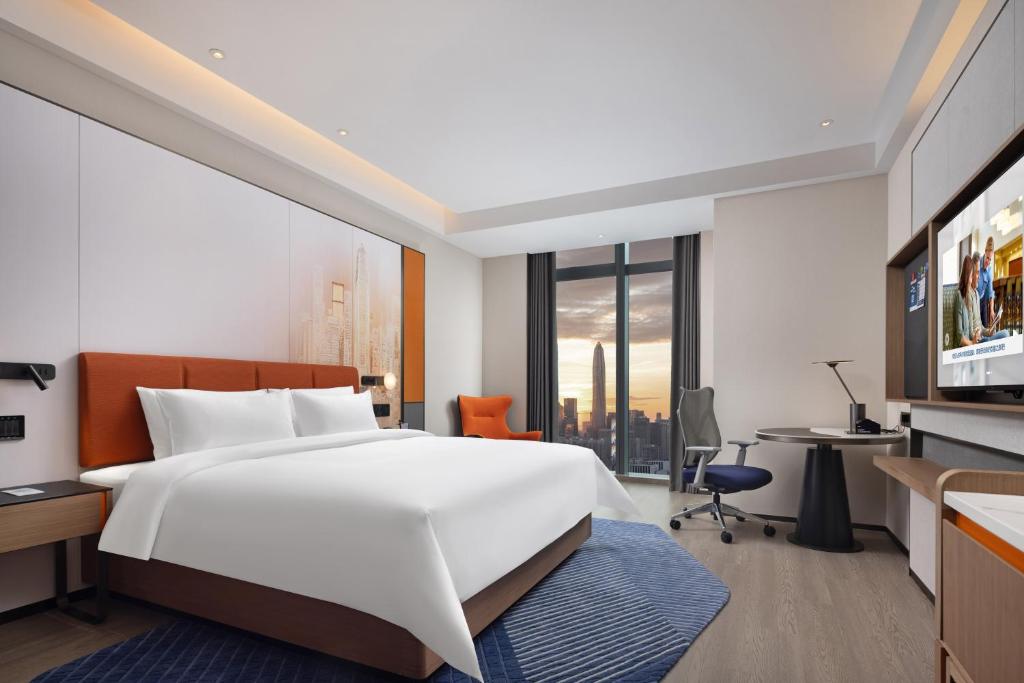 TV a/nebo společenská místnost v ubytování Hampton by Hilton Shenzhen Futian Huaqiangbei