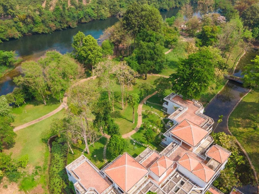 an aerial view of a mansion with a river at Comsaed River Kwai Resort SHA in Kanchanaburi City