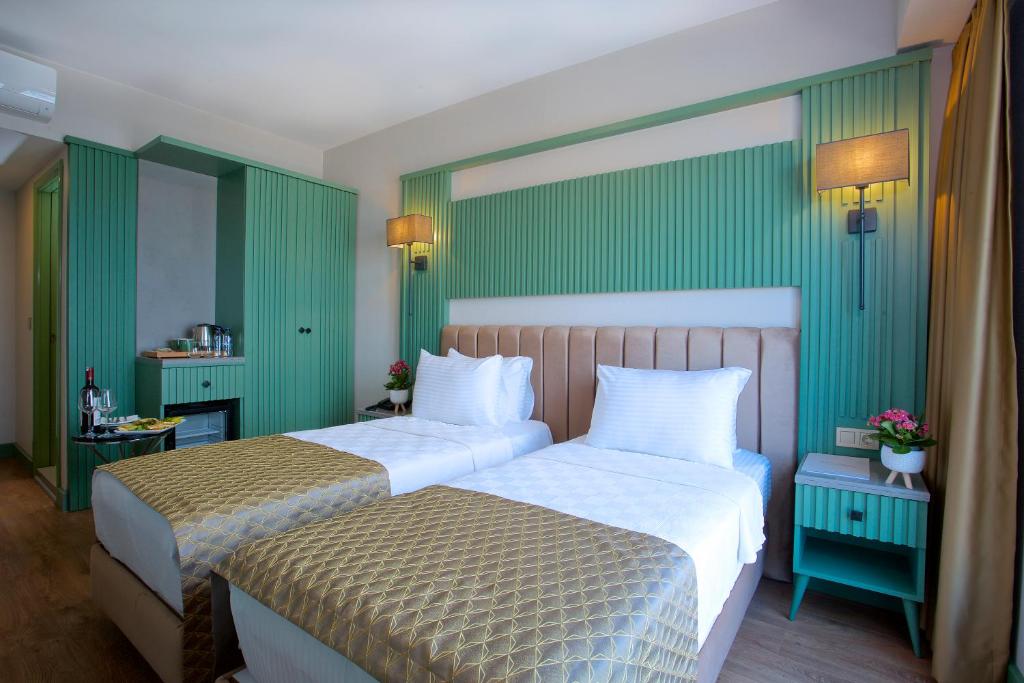Postel nebo postele na pokoji v ubytování Çanakkale Bosphorus Port Aspen Hotel