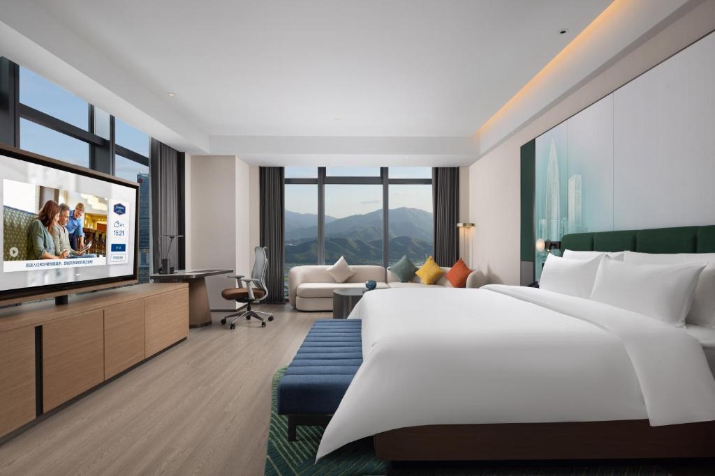 TV a/nebo společenská místnost v ubytování Hampton by Hilton Shenzhen Futian Huaqiangbei