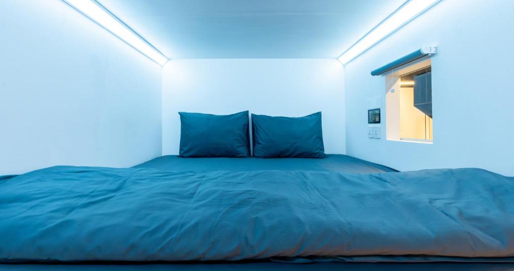 Letto o letti in una camera di Bobopod Thamrin, Jakarta