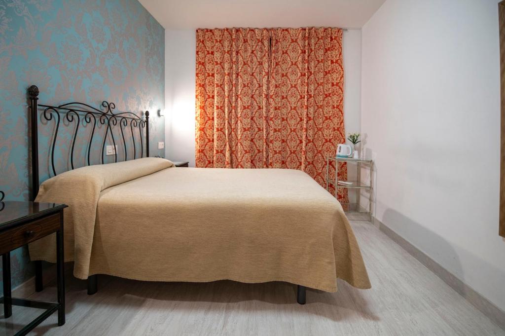 Cama o camas de una habitación en Hotel Manzanito