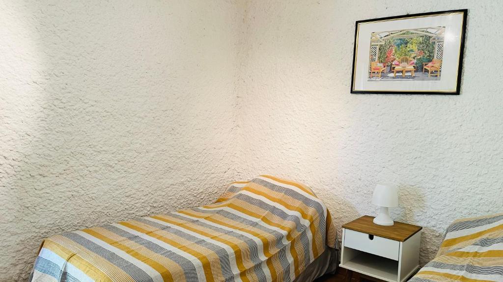 Postel nebo postele na pokoji v ubytování Studio Cocody 6 LUMIO