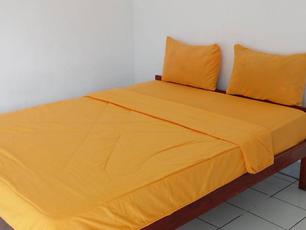 Postel nebo postele na pokoji v ubytování Hidayah homestay