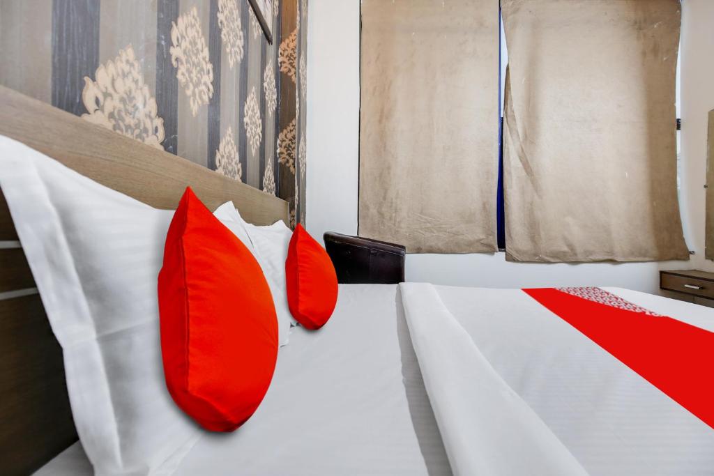 Krevet ili kreveti u jedinici u objektu OYO Flagship Hotel Skyorchid