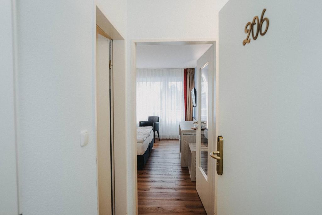 Postel nebo postele na pokoji v ubytování Hotel Spiekeroog