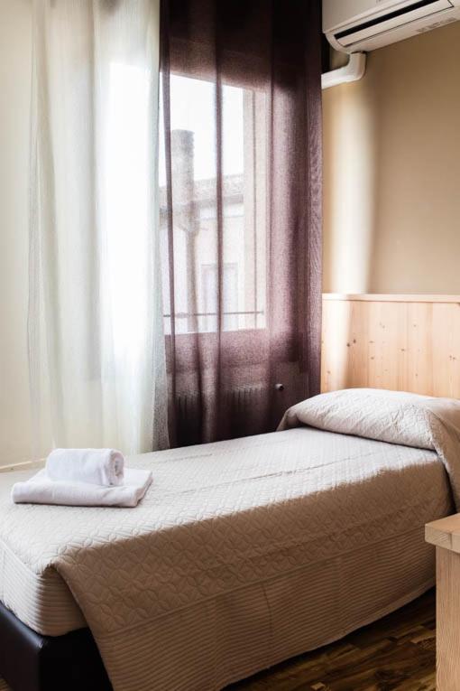 Postel nebo postele na pokoji v ubytování Locanda Montegrappa