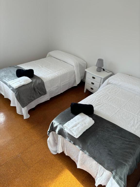 En eller flere senger på et rom på Chalet Galicia Landin