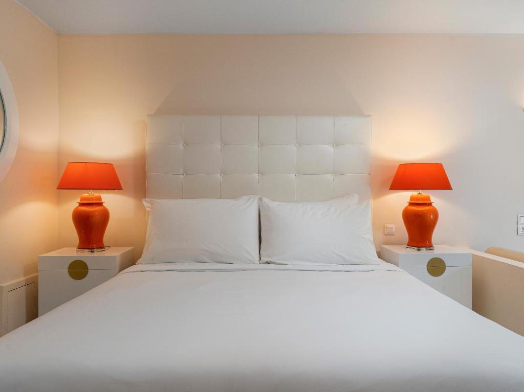 Кровать или кровати в номере Grecotel Creta Palace
