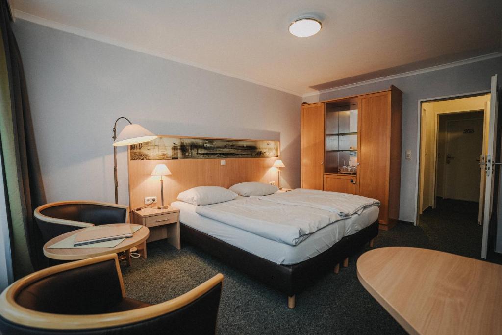 Postel nebo postele na pokoji v ubytování Hotel Spiekeroog