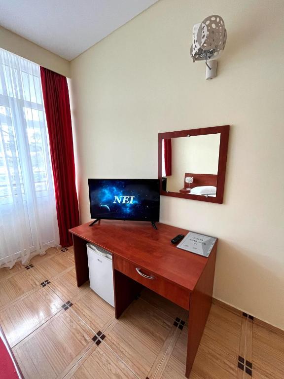 TV a/nebo společenská místnost v ubytování Hotel Callatis