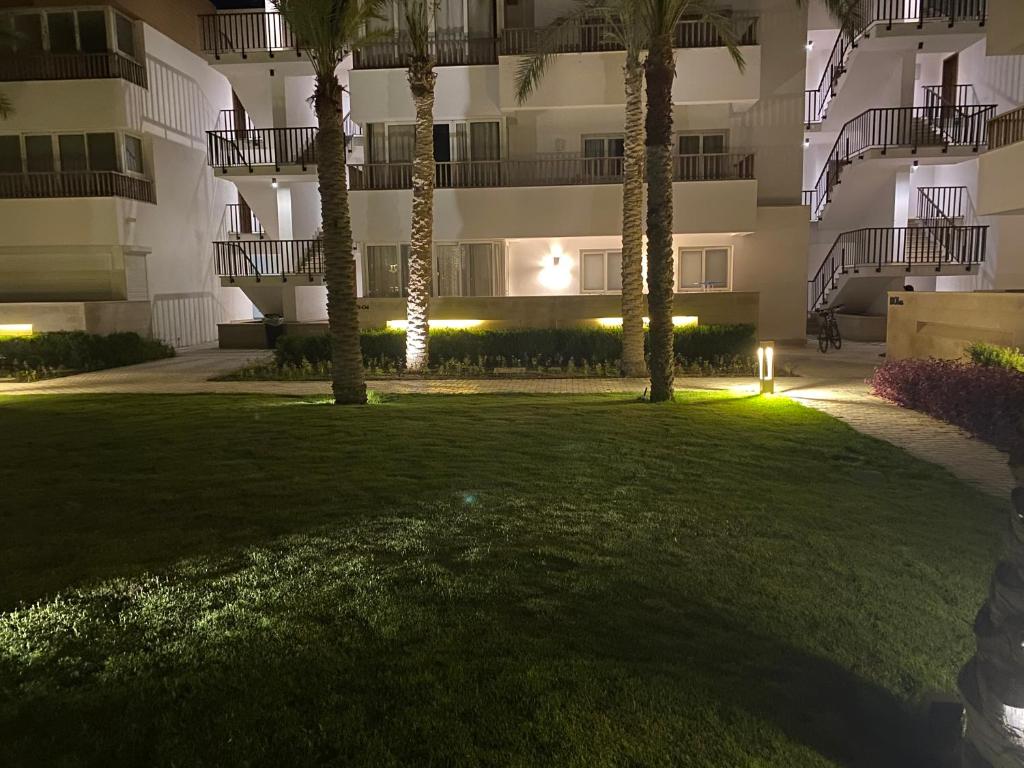 a park in front of a building at night at Almaza Bay, 2 bd ground floor (Prime location) in Marsa Matruh