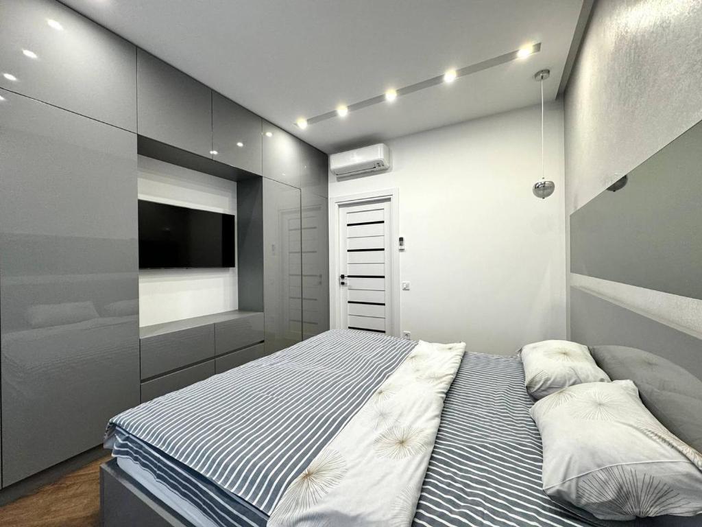 Postel nebo postele na pokoji v ubytování Arcadia Luxury Apartments