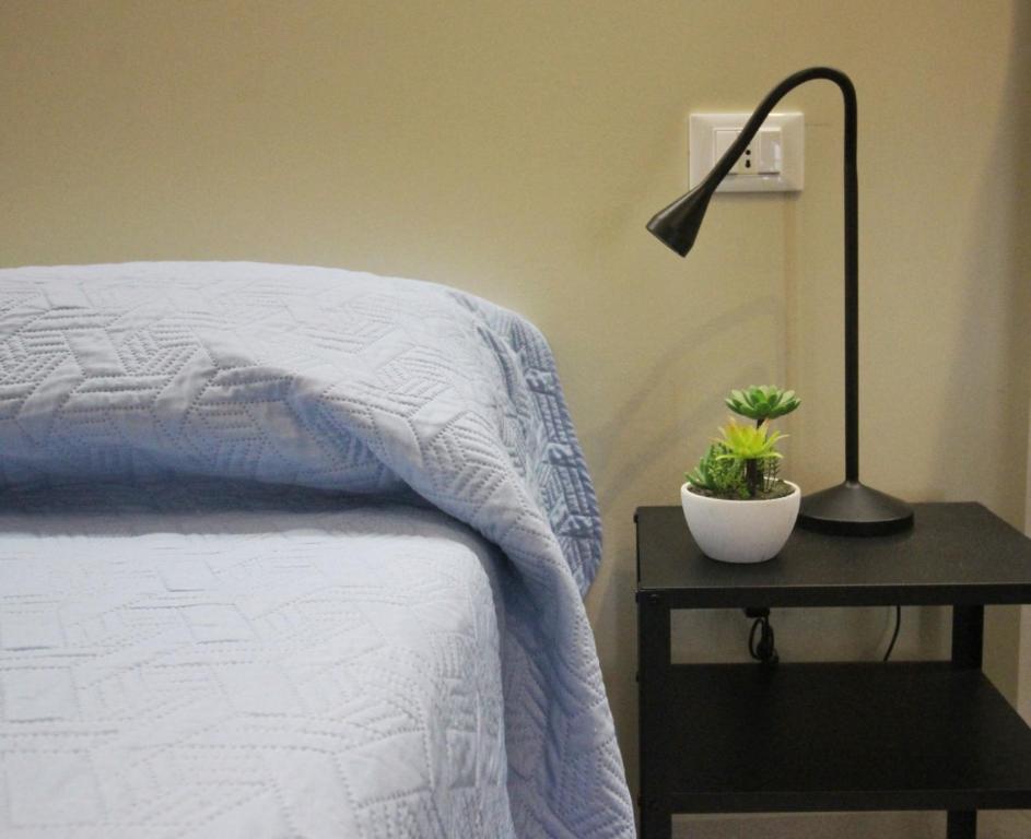 Postel nebo postele na pokoji v ubytování Azzurro Mare Aparthotel