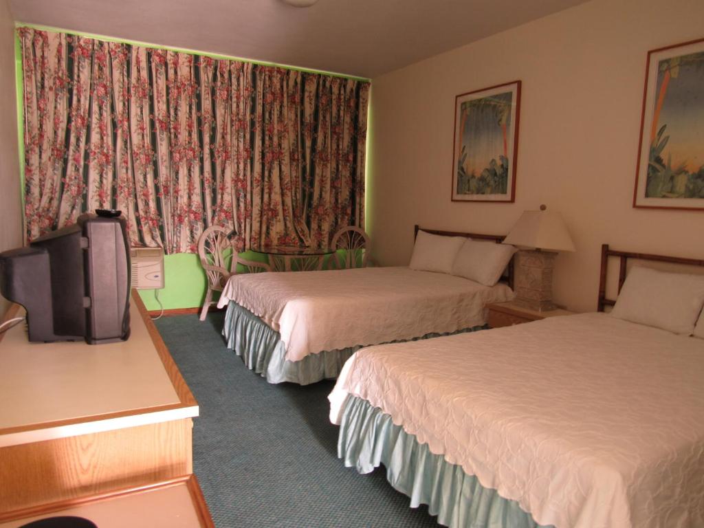 Postel nebo postele na pokoji v ubytování Hotel Perichi's