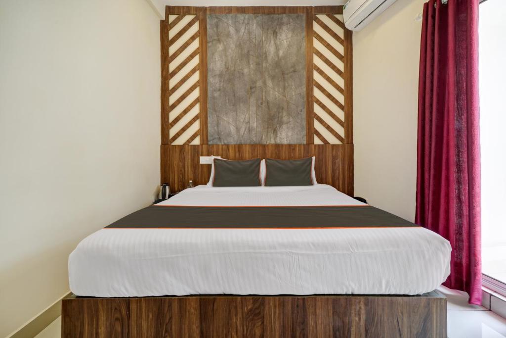 Postel nebo postele na pokoji v ubytování GYPSY HOTEL CUSAT