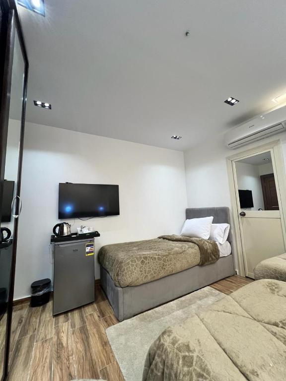 Postel nebo postele na pokoji v ubytování White Pyramids inn