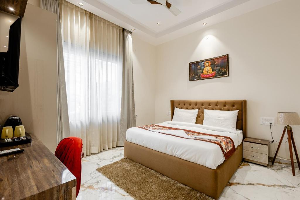 Postel nebo postele na pokoji v ubytování Lime Tree B&B Pari Chowk