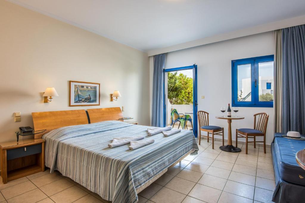 Posteľ alebo postele v izbe v ubytovaní Hotel Hara Ilios Village