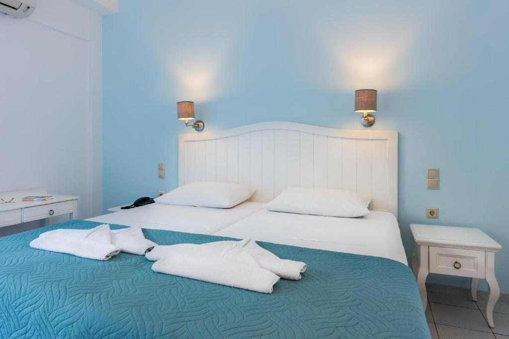 Posteľ alebo postele v izbe v ubytovaní Hotel Hara Ilios Village