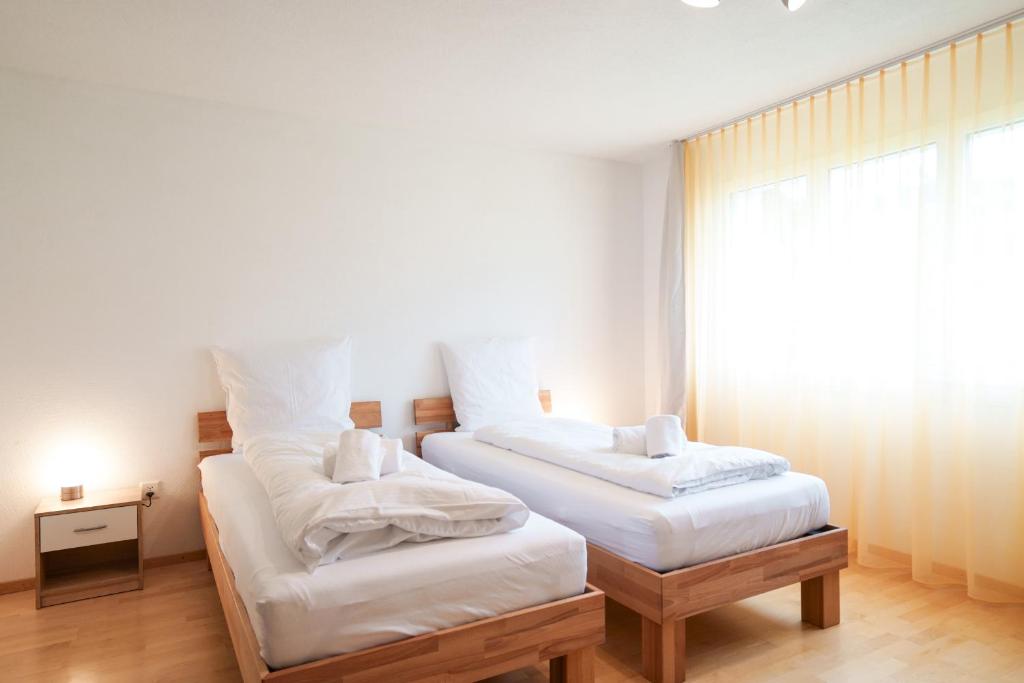 מיטה או מיטות בחדר ב-Haus Gmür Amden Obergeschoss