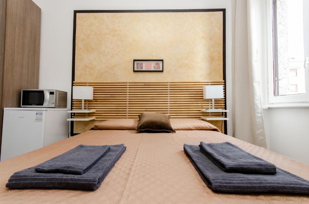 Postel nebo postele na pokoji v ubytování Noisette Room