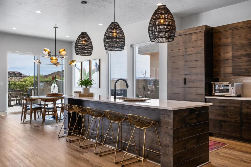 a kitchen with a large island with bar stools at Bunker on the 8th in Washington