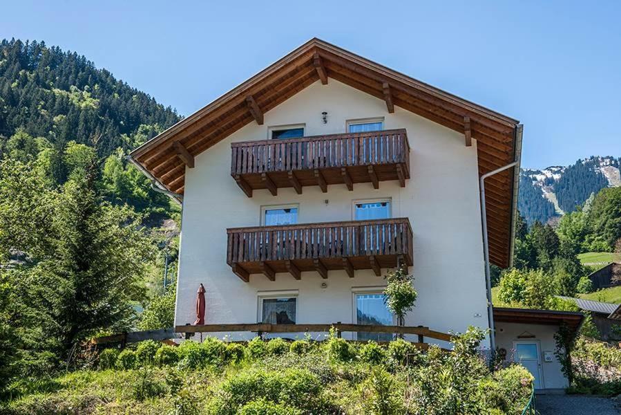 a house with a balcony on the side of it at Haus Montanara myRelaxs in Tschagguns
