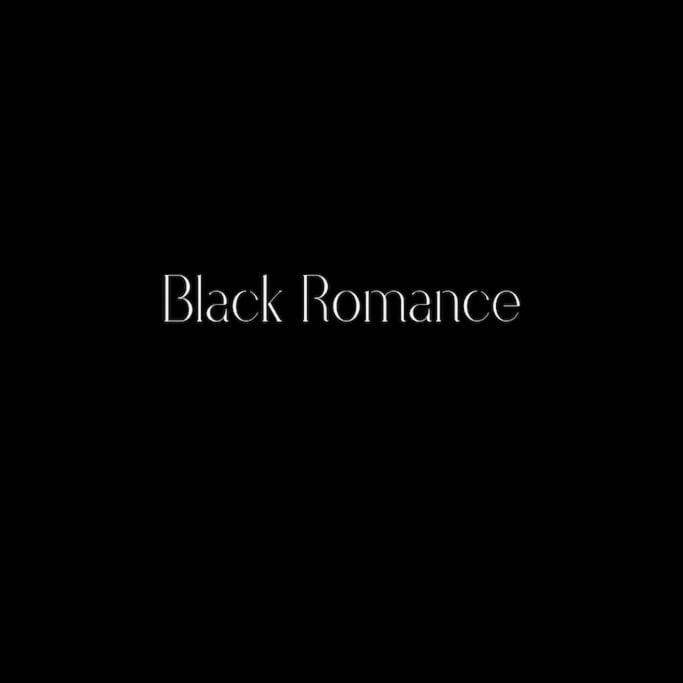 a sign that reads black resonance in a dark room at Black Romance in Yville-sur-Seine