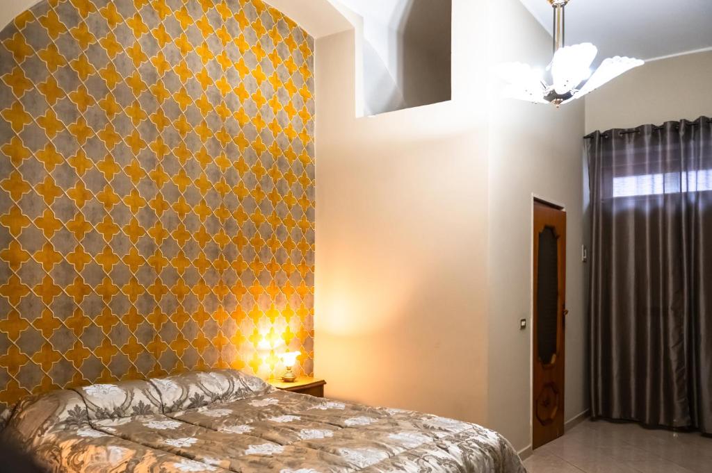 Postel nebo postele na pokoji v ubytování Casa Luca - Siti storici e ottima cucina locale