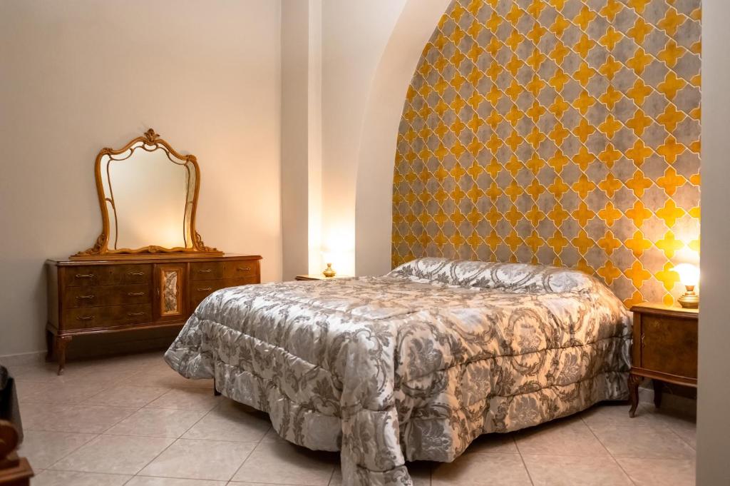 Postel nebo postele na pokoji v ubytování Casa Luca - Siti storici e ottima cucina locale