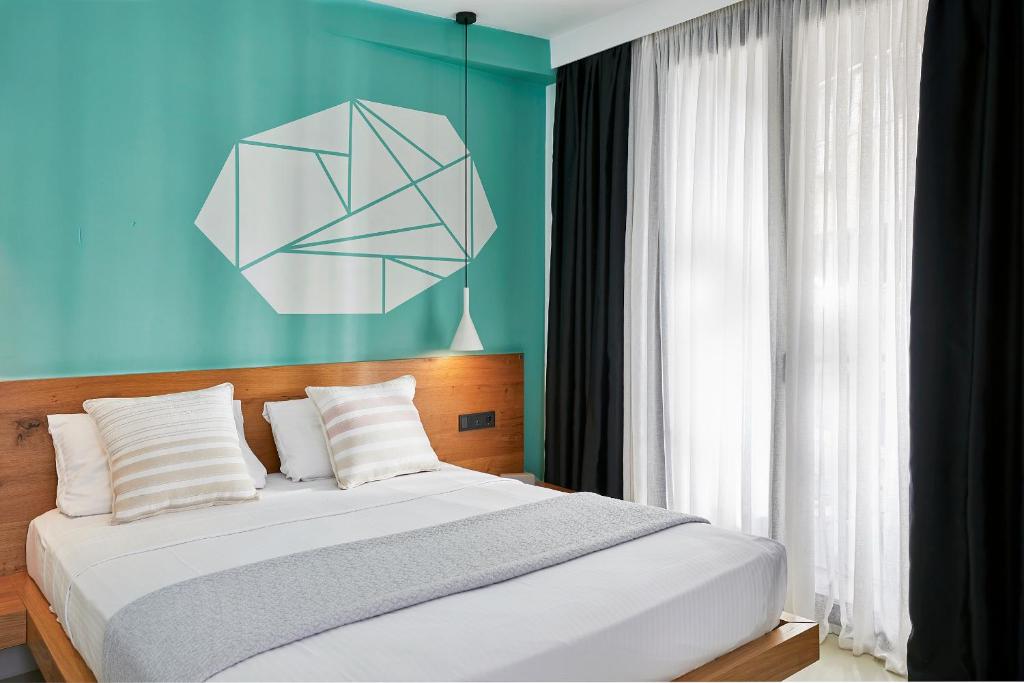 Letto o letti in una camera di Mosaikon